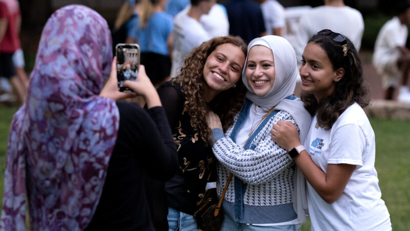 Friends taking a photo smiling