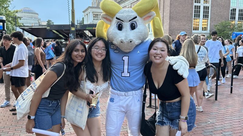 Students at UNC taking a photo with Rameses